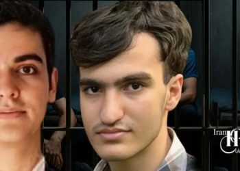 Elite students Ali Younesi and Amirhossein Moradi face fabricated charges in Iran. Younesi’s absence at trial raises concerns of state-sponsored abduction.