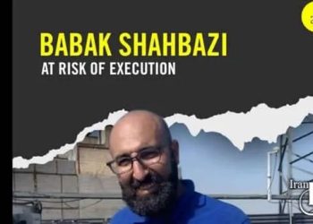 Babak Shahbazi faces execution in Iran’s Ghezel Hesar Prison. His mother pleads for help amid no contact and fears of secret execution.