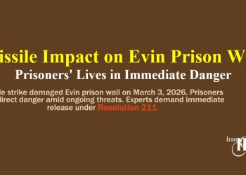 Missile strike damaged Evin prison wall on March 3, 2026. Prisoners face direct danger amid ongoing threats. Experts demand immediate release under Resolution 211.