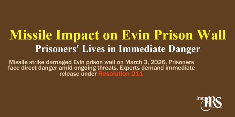 Missile strike damaged Evin prison wall on March 3, 2026. Prisoners face direct danger amid ongoing threats. Experts demand immediate release under Resolution 211.